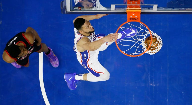 Philadelphia 76ers' Ben Simmons, right, dunks past Chicago Bulls' Thaddeus Young during the first half of an NBA basketball game, Sunday, Feb. 9, 2020, in Philadelphia. Philadelphia 76ers' Ben Simmons, right, dunks past Chicago Bulls' Thaddeus Young during the first half of an NBA basketball game, Sunday, Feb. 9, 2020, in Philadelphia.