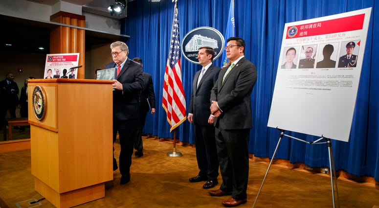 Attorney General William Barr, left, arrives to speak, next to Assistant Attorney General John Demers and U.S. Attorney for the Northern District of Georgia Byung "BJay" Pak, right, during a news conference. Attorney General William Barr, left, arrives to speak, next to Assistant Attorney General John Demers and U.S. Attorney for the Northern District of Georgia Byung "BJay" Pak, right, during a news conference.