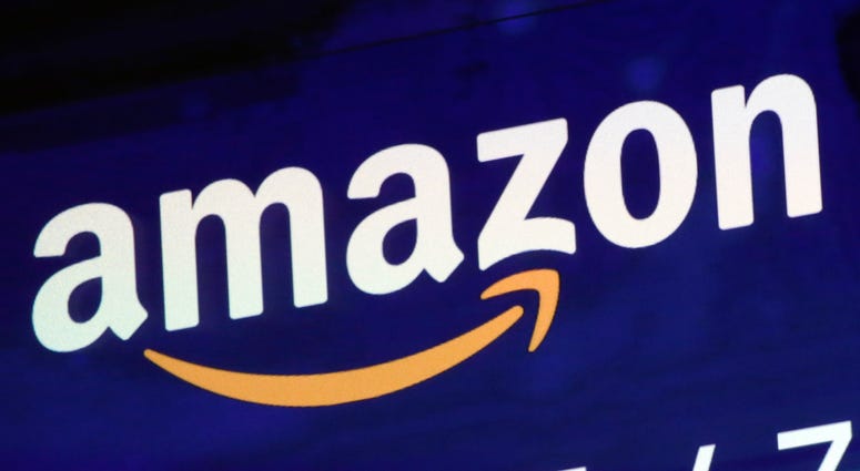 The logo for Amazon is displayed on a screen at the Nasdaq MarketSite in New York. The logo for Amazon is displayed on a screen at the Nasdaq MarketSite in New York.