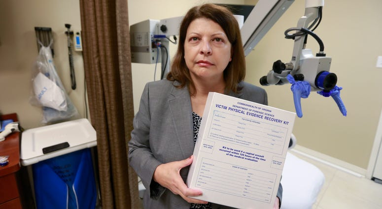 Director of the forensic nursing program at the Bon Secours St. Mary's Hospital, Bonnie Price, holds an evidence kit in the examination room at the hospital in Richmond, Va., Wednesday, Oct. 30, 2019. Director of forensic nursing program holds a rape evidence kit