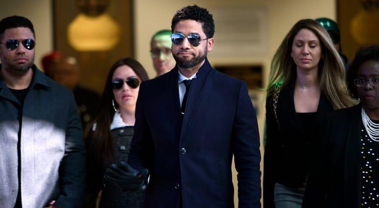In this March 26, 2019 file photo, actor Jussie Smollett gestures as he leaves Cook County Court after his charges were dropped in Chicago. Jussie Smollett