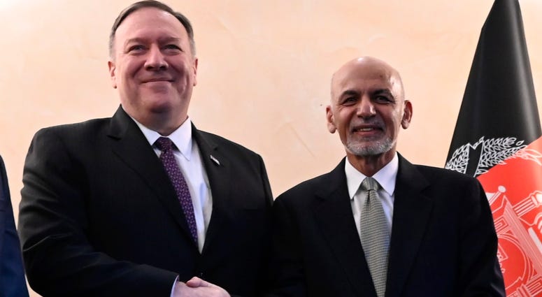 U.S. Secretary of State Mike Pompeo, left, shakes hands with Afghan President Ashraf Ghani, during the 56th Munich Security Conference (MSC) in Munich, Germany, Feb. 14, 2020. U.S. Secretary of State Mike Pompeo and Afghan President Ashraf Ghani.
