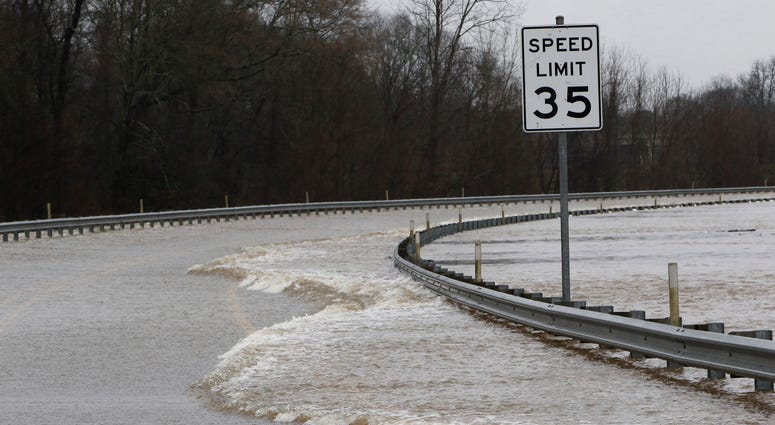The National Weather Service lowered the anticipated Pearl River crest to 37.5' by Monday morning. However, it will still be the third highest point behind the historic floods of 1979 and 1983. Strong currents from the swollen Pearl River flood over the Old Brandon Road Bridge in Jackson, Miss., Sunday, Feb. 16, 2020.