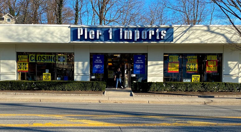 A customer steps out of a Pier 1 Imports store which was having a closeout sale, Monday, Feb. 17, 2020, in Larchmont, N.Y. Pier 1 Imports
