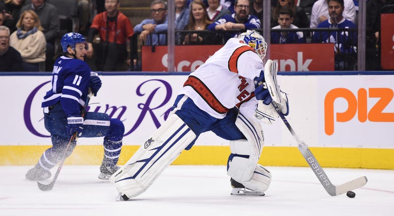 David Ayres, who serves as the Toronto Marlies' Zamboni driver, replaced Petr Mrazek in-net after a delay in action. Carolina Hurricanes emergency goalie David Ayres, right, comes out of his net to play the puck against the Toronto Maple Leafs during second-period NHL hockey action in Toronto, Saturday, Feb. 22, 2020.