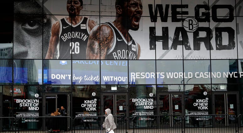 A pedestrian passes an entrance to the Barclays Center in the Brooklyn borough of New York. A pedestrian passes an entrance to the Barclays Center in the Brooklyn borough of New York.
