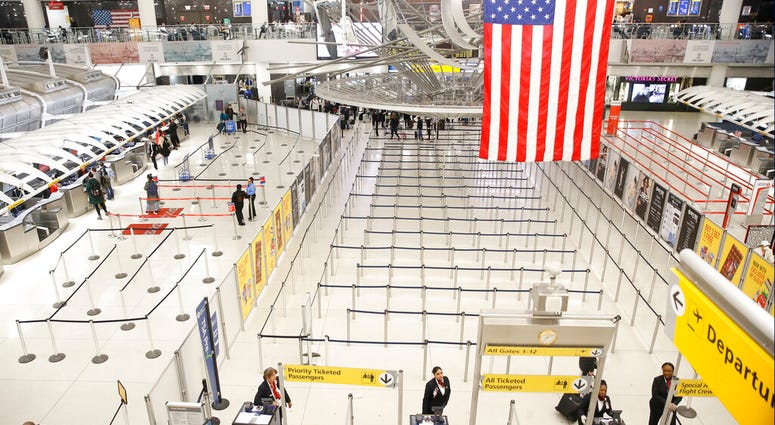 The area for TSA screening of travelers at JFK airport's Terminal 1 is relatively empty, Friday, March 13, 2020, in New York. The area for TSA screening of travelers at JFK airport's Terminal 1 is relatively empty, Friday, March 13, 2020, in New York.