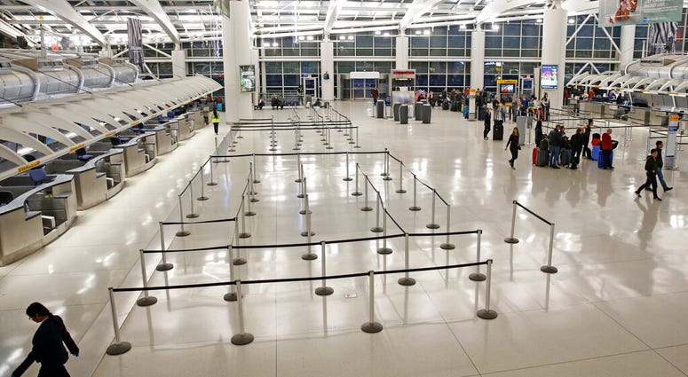 People visit an international terminal at John F. Kennedy airport, Friday, March 13, 2020, in New York. People visit an international terminal at John F. Kennedy airport, Friday, March 13, 2020, in New York.
