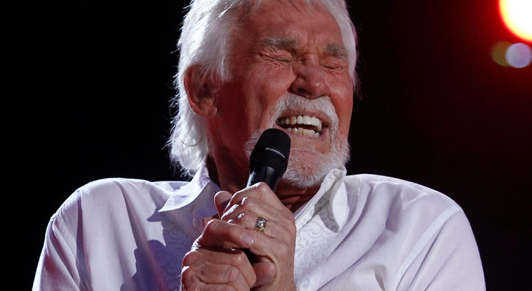 Singer Kenny Rogers, the smooth, Grammy-winning balladeer who spanned jazz, folk, country and pop with such hits as “Lucille,” “Lady” “Islands in the Stream,” and “The Gambler,” died Friday night. He was 81. In this June 9, 2012, file photo, Kenny Rogers performs at the 2012 CMA Music Festival in Nashville, Tenn.