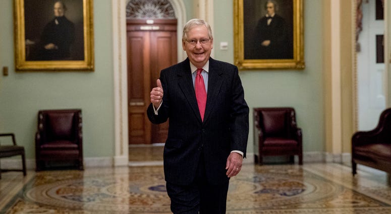 Senate Majority Leader Mitch McConnell of Ky. gives a thumbs up as he arrives on Capitol Hill, Wednesday, March 25, 2020, in Washington. Senate Majority Leader Mitch McConnell of Ky. gives a thumbs up as he arrives on Capitol Hill, Wednesday, March 25, 2020, in Washington.