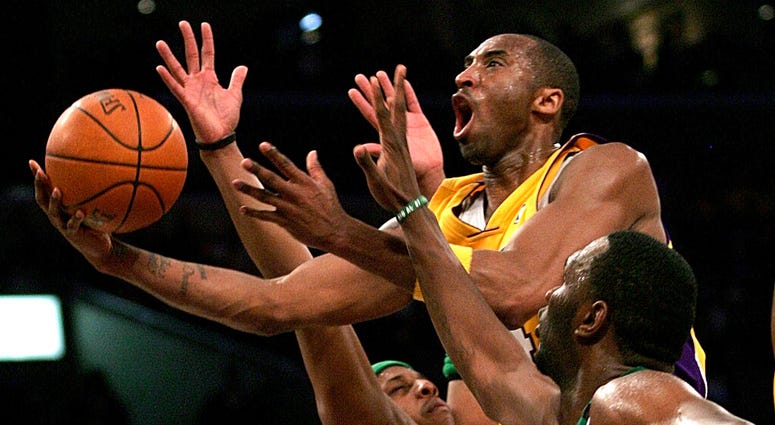 In this Feb. 23, 2007, file photo, Los Angeles Lakers' Kobe Bryant, top, goes up for a shot between Boston Celtics' Paul Pierce, left, and Al Jefferson during the first half of an NBA basketball game in Los Angeles. In this Feb. 23, 2007, file photo, Los Angeles Lakers' Kobe Bryant, top, goes up for a shot between Boston Celtics' Paul Pierce, left, and Al Jefferson during the first half of an NBA basketball game in Los Angeles.