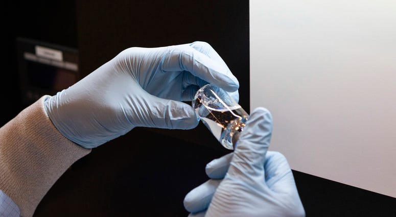 A vial of the investigational drug remdesivir is visually inspected at a Gilead manufacturing site in the United States. A vial of the investigational drug remdesivir is visually inspected at a Gilead manufacturing site in the United States.