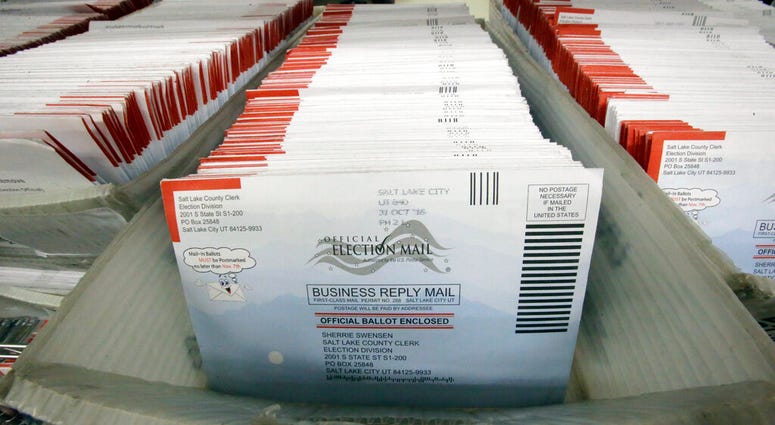 In this Nov. 1, 2016, file photo, mail-in ballots for the 2016 General Election are shown at the elections ballot center at the Salt Lake County Government Center, in Salt Lake City. In this Nov. 1, 2016, file photo, mail-in ballots for the 2016 General Election are shown at the elections ballot center at the Salt Lake County Government Center, in Salt Lake City.