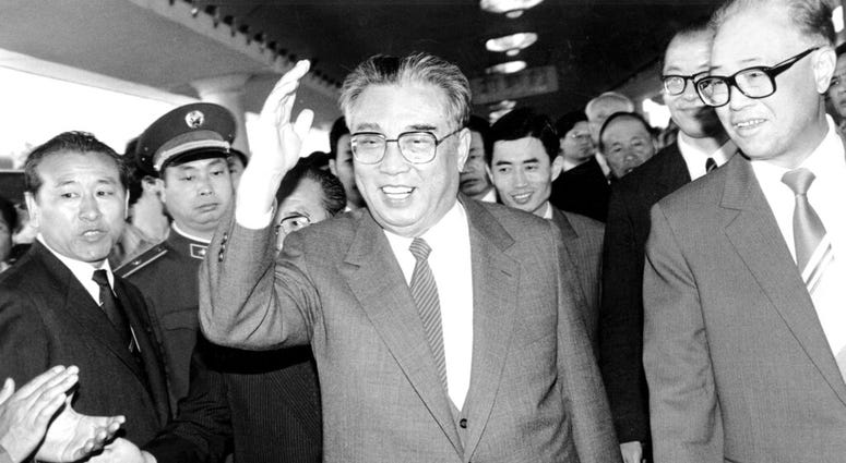 In this May 21, 1987, file photo, then North Korean President Kim Il Sung, center, and then Chinese Premier Zhao Ziyang make their way through a crowd of well-wishers at the train station in Beijing. In this May 21, 1987, file photo, then North Korean President Kim Il Sung, center, and then Chinese Premier Zhao Ziyang make their way through a crowd of well-wishers at the train station in Beijing.