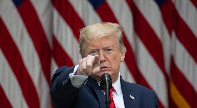 President Donald Trump points to a questioner on May 11, 2020, as he speaks about the coronavirus during a press briefing in the Rose Garden of the White House in Washington, D.C. President Donald Trump points to a questioner on May 11, 2020, as he speaks about the coronavirus during a press briefing in the Rose Garden of the White House in Washington, D.C.