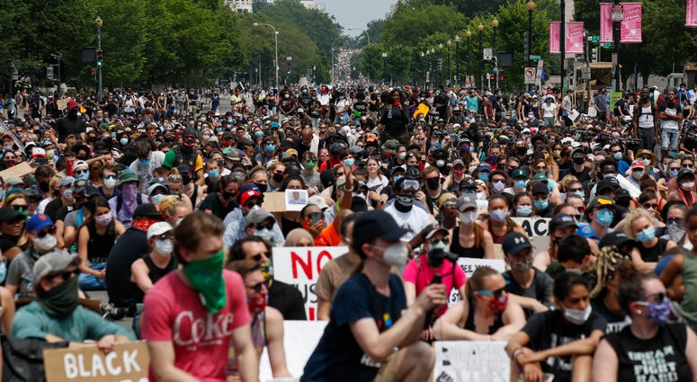 Demonstrators protest Saturday, June 6, 2020, in Washington, over the death of George Floyd, a black man who was in police custody in Minneapolis. Floyd died after being restrained by Minneapolis police officers. Demonstrators protest Saturday, June 6, 2020, in Washington, over the death of George Floyd, a black man who was in police custody in Minneapolis. Floyd died after being restrained by Minneapolis police officers.