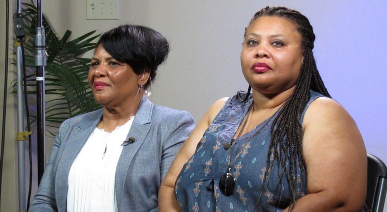In this June 7, 2018 file photo, Alice Marie Johnson, left, and her daughter Katina Marie Scales wait to start a TV interview on in Memphis, Tenn. In this June 7, 2018 file photo, Alice Marie Johnson, left, and her daughter Katina Marie Scales wait to start a TV interview on in Memphis, Tenn.