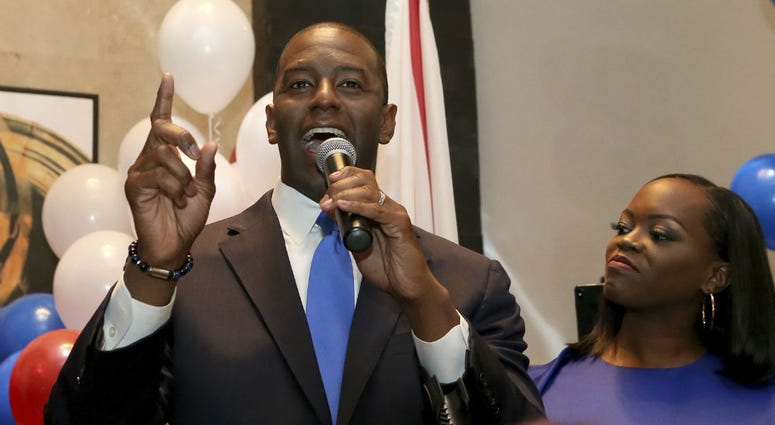 Andrew Gillum with his wife, R. Jai Gillum at his side addresses his supporters after winning the Democrat primary for governor on Tuesday, Aug. 28, 2018, in Tallahassee, Fla. Andrew Gillum with his wife, R. Jai Gillum at his side addresses his supporters after winning the Democrat primary for governor on Tuesday, Aug. 28, 2018, in Tallahassee, Fla.