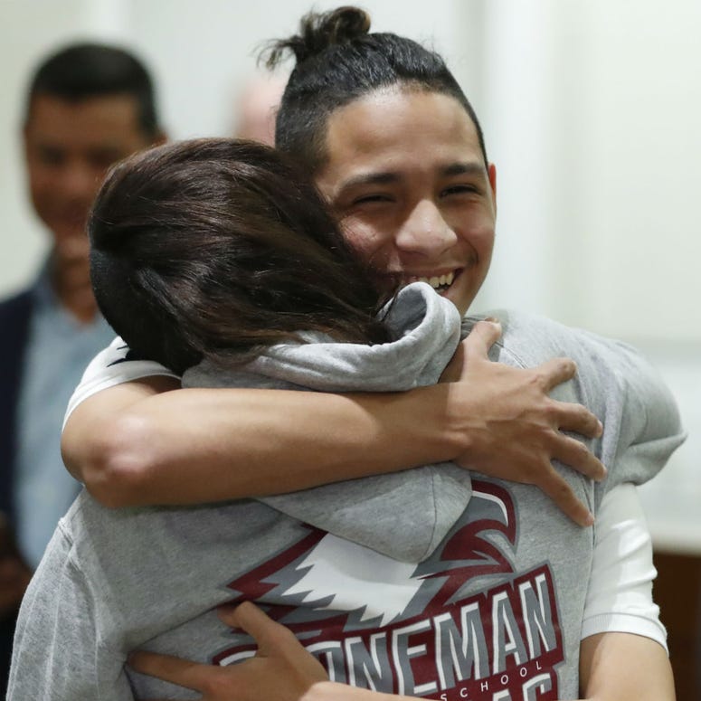 Anthony Borges, rear, who was shot during the Parkland, Fla., school shooting, hugs Marianne Sheehan after a news conference with Florida governor Ron DeSantis, Wednesday, Feb. 13, 2019, in Fort Lauderdale, Fla. Anthony Borges, rear, who was shot during the Parkland, Fla., school shooting, hugs Marianne Sheehan after a news conference with Florida governor Ron DeSantis, Wednesday, Feb. 13, 2019, in Fort Lauderdale, Fla.
