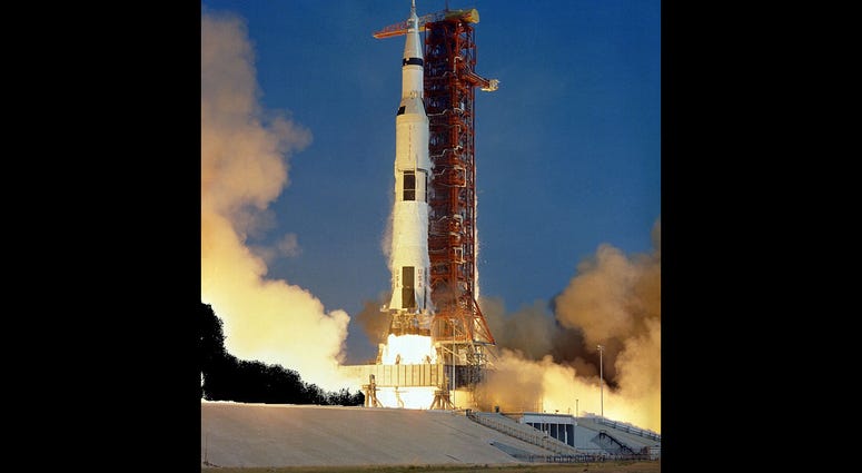 The Apollo 11 Saturn V space vehicle lifts off with Astronauts Neil A. Armstrong, Michael Collins and Edwin E. Aldrin Jr. at 9:32 a.m. EDT July 16, 1969, from Kennedy Space Center's Launch Complex 39A The Apollo 11 Saturn V space vehicle lifts off with Astronauts Neil A. Armstrong, Michael Collins and Edwin E. Aldrin Jr. at 9:32 a.m. EDT July 16, 1969, from Kennedy Space Center's Launch Complex 39A