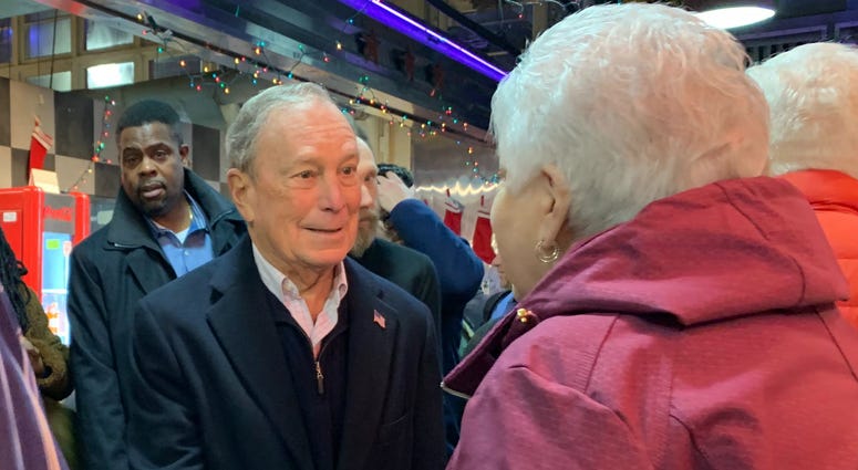 Former New York mayor turned Democratic presidential candidate Michael Bloomberg greets a woman at Reading Terminal Market. Former New York mayor turned Democratic presidential candidate Michael Bloomberg greets a woman at Reading Terminal Market.