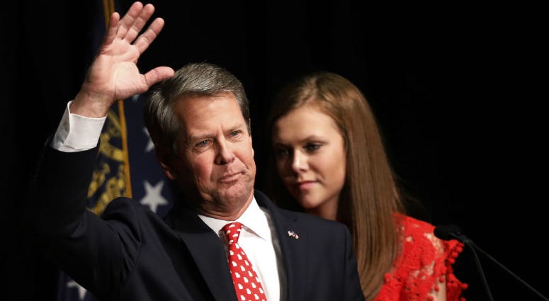 Georgia Republican gubernatorial candidate Brian Kemp acknowledges supporters early Wednesday, Nov. 7, 2018, after a long election night in Athens, Ga. Georgia Republican gubernatorial candidate Brian Kemp acknowledges supporters early Wednesday, Nov. 7, 2018, after a long election night in Athens, Ga.