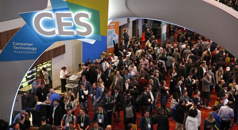 In this Jan. 9, 2018, file photo, people attend CES International in Las Vegas. In this Jan. 9, 2018, file photo, people attend CES International in Las Vegas.