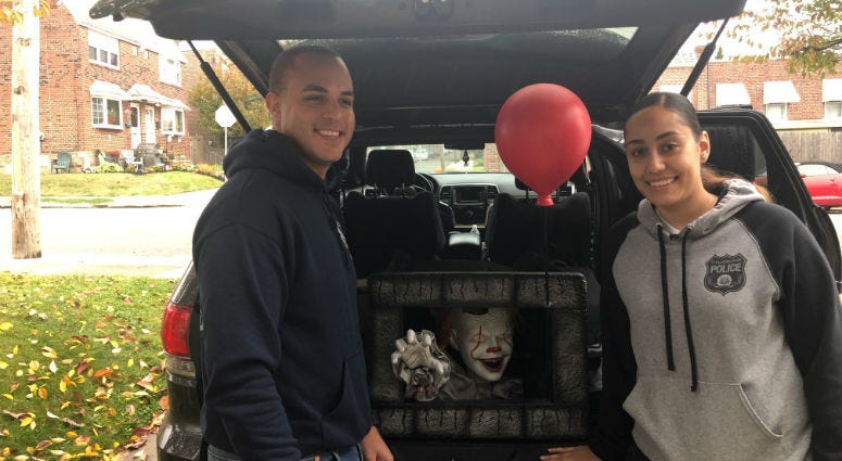 Officers Yesenia Rivera and Adrian Toribio are volunteering their time Wednesday night to bring the kids in the area a little bit of safe Halloween terror. Philadelphia Police Officers Yesenia Rivera and Adrian Toribio show their 'Pennywise' Halloween props.