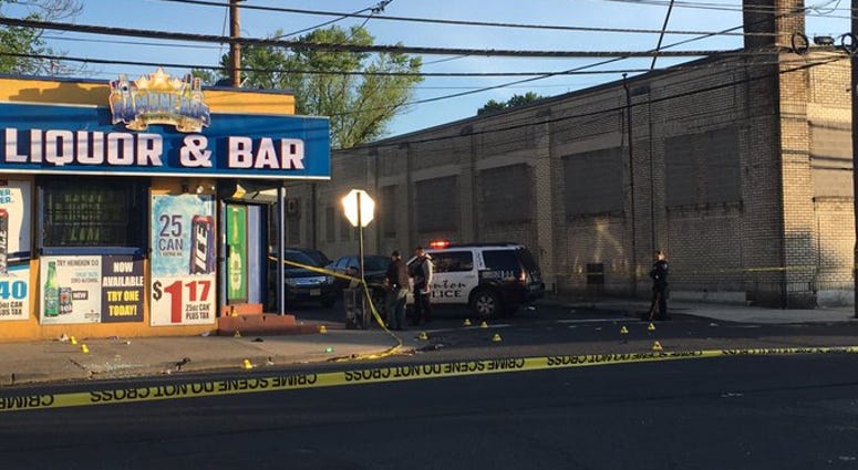 Police tape cordons off street in Trenton, New Jersey where ten people were shot when gunfire erupted outside a bar. Trenton Shooting