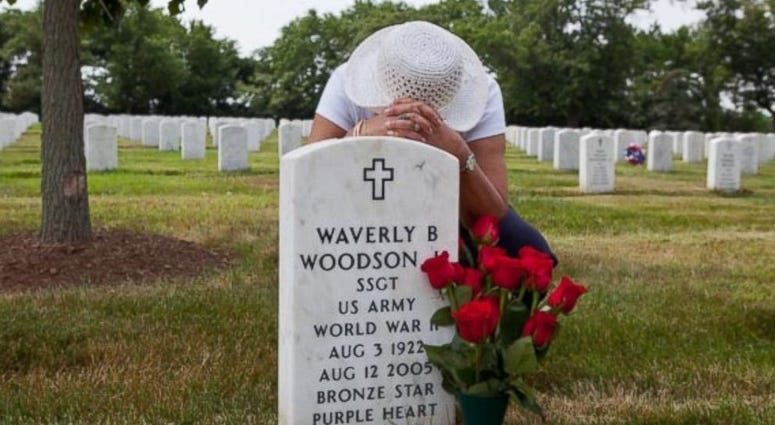 Joann Woodson visits the grave of her late husband and war hero, Waverly Woodson. Joann Woodson