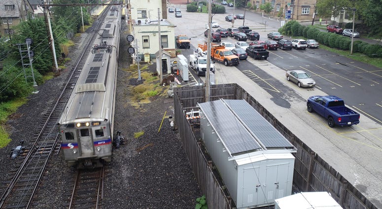 SEPTA regional rail with solar-powered signal SEPTA regional rail with solar-powered signal
