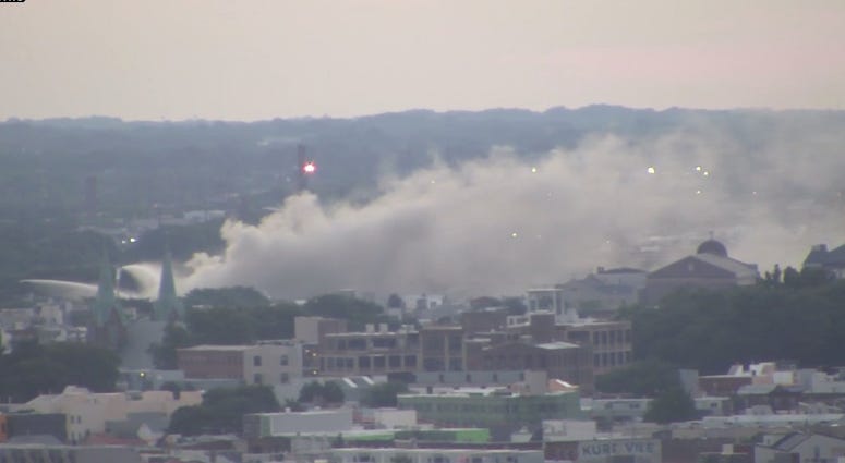 Smoke still pours from the scene of a huge junk yard fire in Kensington, Philadelphia. Smoke still pours from the scene of a huge junk yard fire in Kensington, Philadelphia.