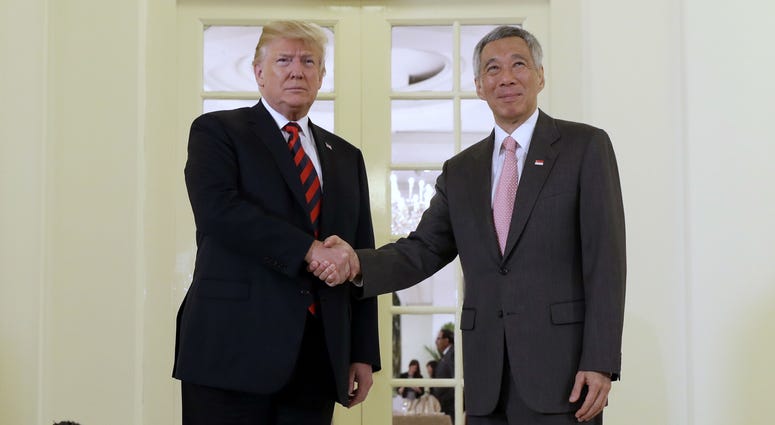 President Donald Trump shakes hands as he meets with Singapore Prime Minister Lee Hsien Loong ahead of a summit with North Korean leader Kim Jong Un, Monday, June 11, 2018, in Singapore. President Donald Trump shakes hands as he meets with Singapore Prime Minister Lee Hsien Loong