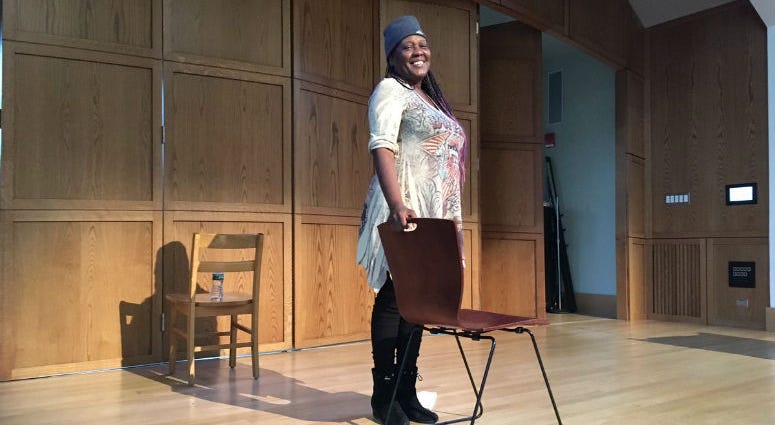 Idris Cooper-Anifowoshe performs "Traveling While Black" on stage at the Penn Museum Traveling While Black