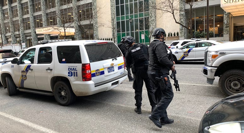 A heavy police presence has formed around The Sterling Apartment Homes at 18th Street and JFK Boulevard, where they are responding to reports of a man with a gun. Center City police barricade