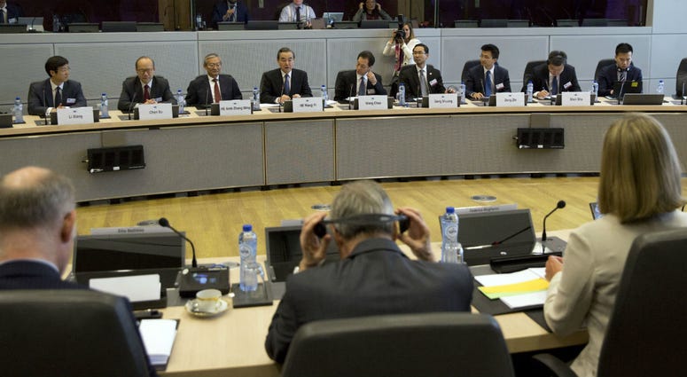 European Union foreign policy chief Federica Mogherini, right, meets with China's Foreign Minister Wang Yi, back row fourth left, at EU headquarters in Brussels, Friday, June 1, 2018. European Union foreign policy chief Federica Mogherini meets with China's Foreign Minister Wang Yi