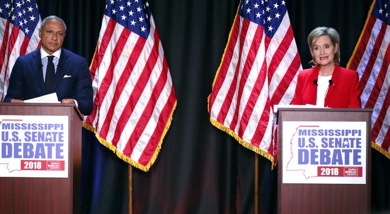 Appointed U.S. Sen. Cindy Hyde-Smith, R-Miss., answers a question while Democrat Mike Espy, left, listens during their televised Mississippi U.S. Senate debate in Jackson, Miss., Tuesday, Nov. 20, 2018. Appointed U.S. Sen. Cindy Hyde-Smith, R-Miss., answers a question while Democrat Mike Espy, left, listens during their televised Mississippi U.S. Senate debate in Jackson, Miss., Tuesday, Nov. 20, 2018.