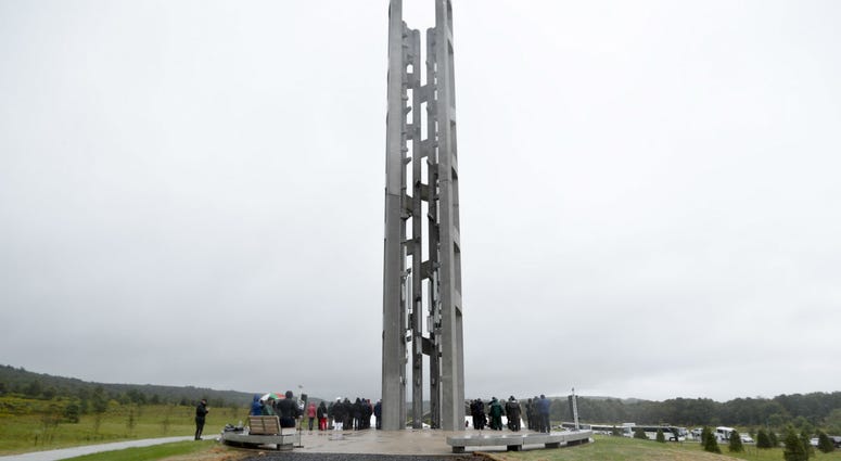In this Sept. 9, 2018 file photo, people attending the dedication stand around the 93-foot tall Tower of Voices at the Flight 93 National Memorial in Shanksville, Pa. In this Sept. 9, 2018 file photo, people attending the dedication stand around the 93-foot tall Tower of Voices at the Flight 93 National Memorial in Shanksville, Pa.