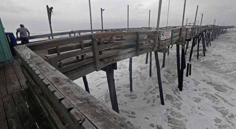Waves crash under the Avalon Fishing Pier in Kill Devil Hills, N.C., Thursday, Sept. 13, 2018 as Hurricane Florence approaches the east coast. Waves crash under the Avalon Fishing Pier in Kill Devil Hills, N.C., Thursday, Sept. 13, 2018 as Hurricane Florence approaches the east coast.