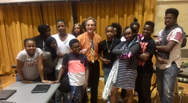 Teacher Kevan Portney and students at E.W. Rhodes Elementary School. Teacher Kevan Portney