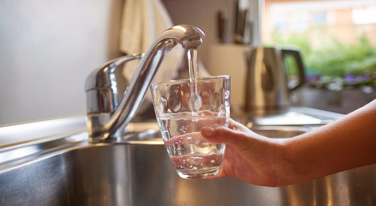 Pouring Fresh Tap Water Into a Glass Pouring Fresh Tap Water Into a Glass