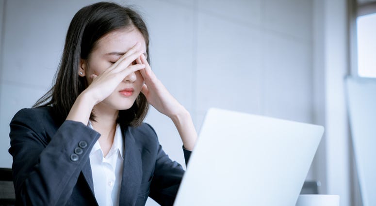 A woman feeling stressed. A woman feeling stressed.