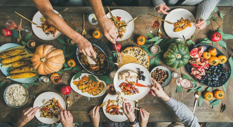 People eating a holiday table. People eating a holiday table.