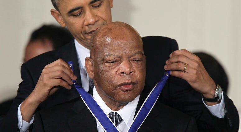 President Barack Obama presents U.S. Rep. John Lewis, D-Ga., with the 2010 Medal of Freedom during an East Room event at the White House February 15, 2011, in Washington, D.C. President Barack Obama honors U.S. Rep. John Lewis with Medal of Freedom