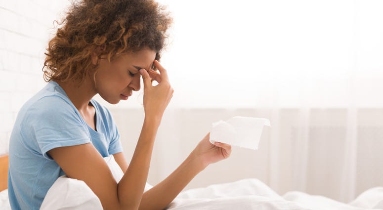 A woman sick in bed. A woman sick in bed.
