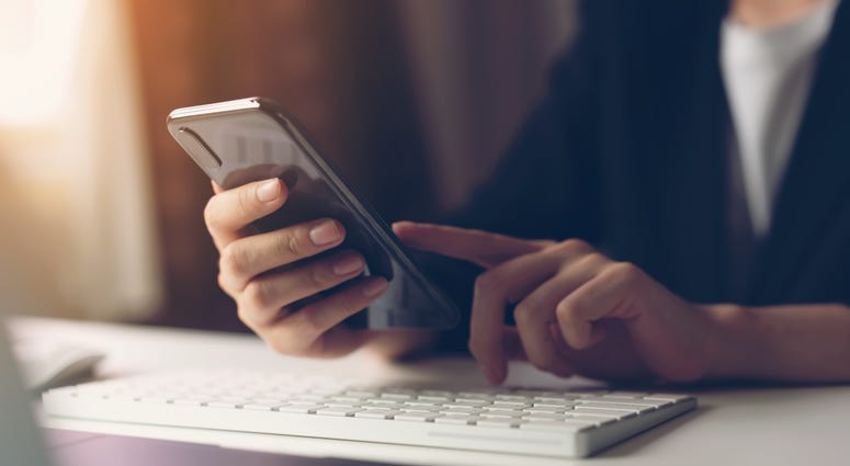 Person using smartphone Person using smartphone