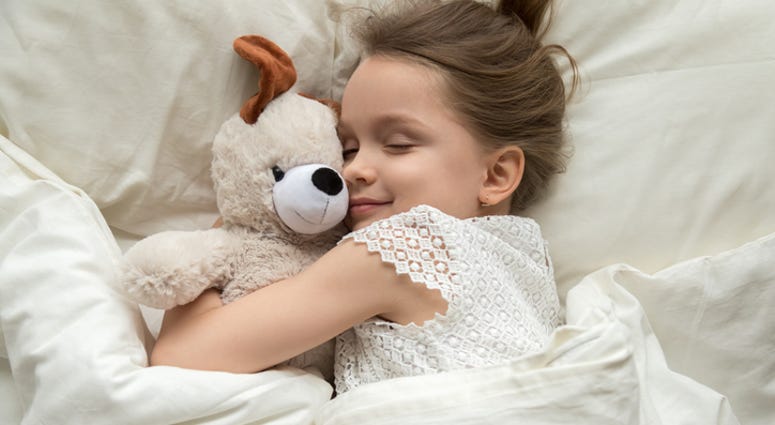 A young girl sleeping. A young girl sleeping.