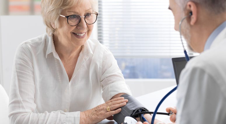 A woman with her doctor. A woman with her doctor.