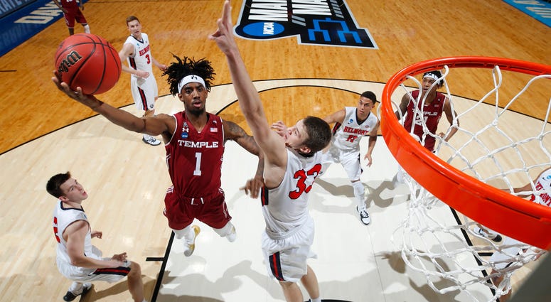 Quinton Rose #1 of the Temple Owls drives to the basket against Nick Muszynski #33 of the Belmont Bruins during the first half in the First Four of the 2019 NCAA Men's Basketball Tournament at UD Arena on March 19, 2019 in Dayton, Ohio. Quinton Rose #1 of the Temple Owls
