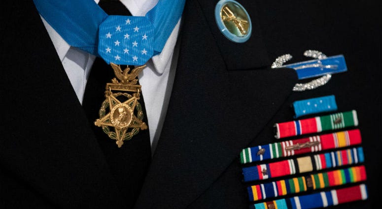 NEW YORK, NY - JULY 3: Retired U.S. Army Staff Sgt. David Bellavia wears the Medal of Honor around his neck before ringing the opening bell at the New York Stock Exchange (NYSE) on July 3, 2019 in New York City. Dozens of black federal lawmakers are teaming up with members of the U.S. Senate to push for a posthumous Medal of Honor for a Overbrook High School graduate.